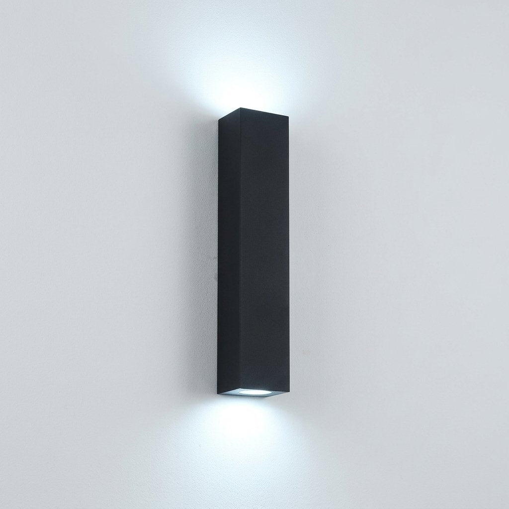 Slab Outdoor Wall Light — slim black rectangular up-and-down wall sconce glowing Cool White