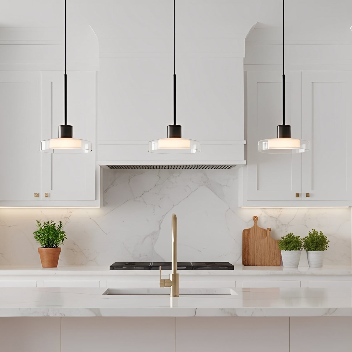Puck Glass Pendant — three pendants above a marble backsplash