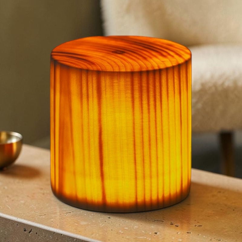 Grove Cube Lamp — travertine console, living room