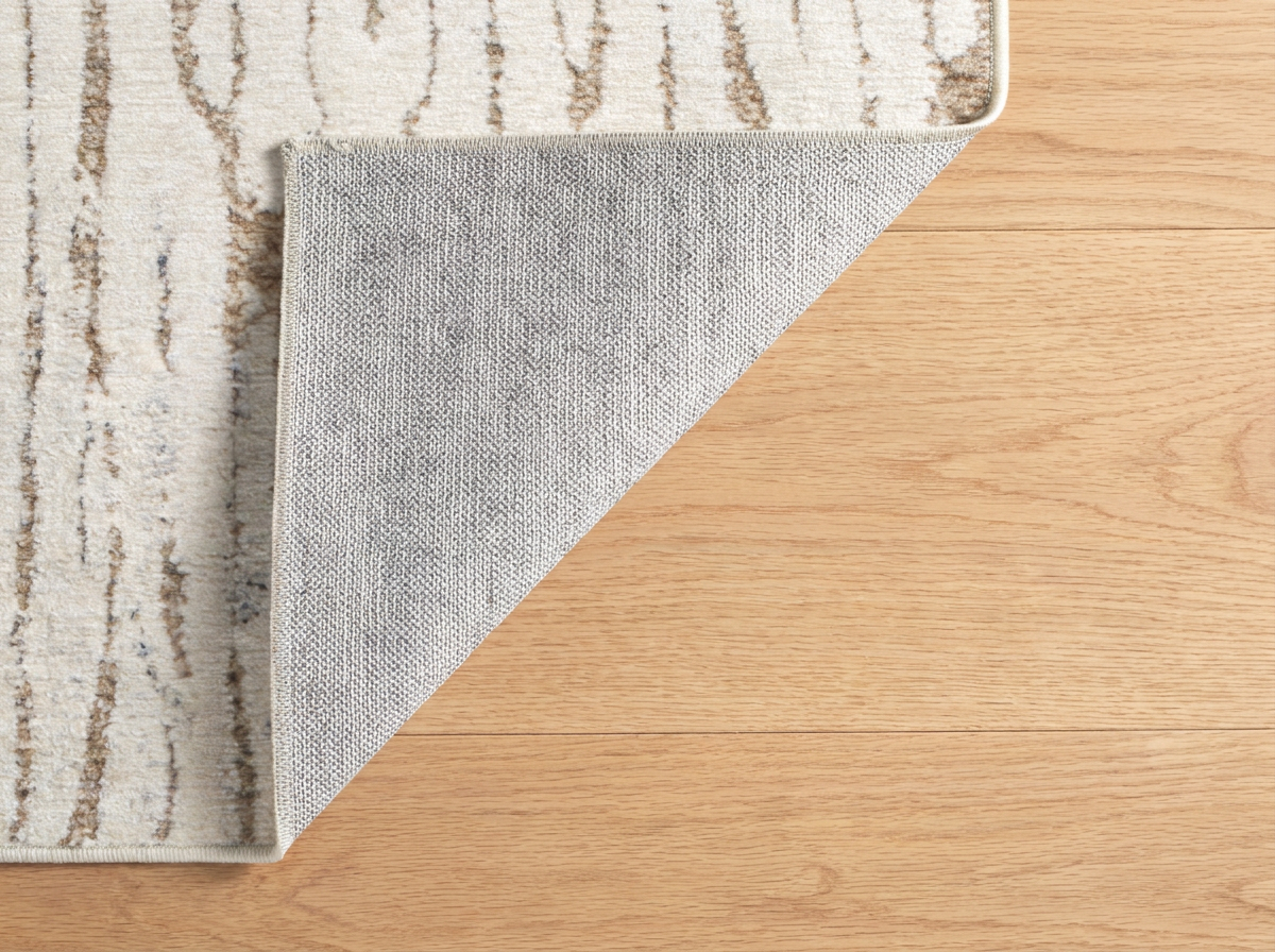 Oatmeal striped rug non-slip backing detail