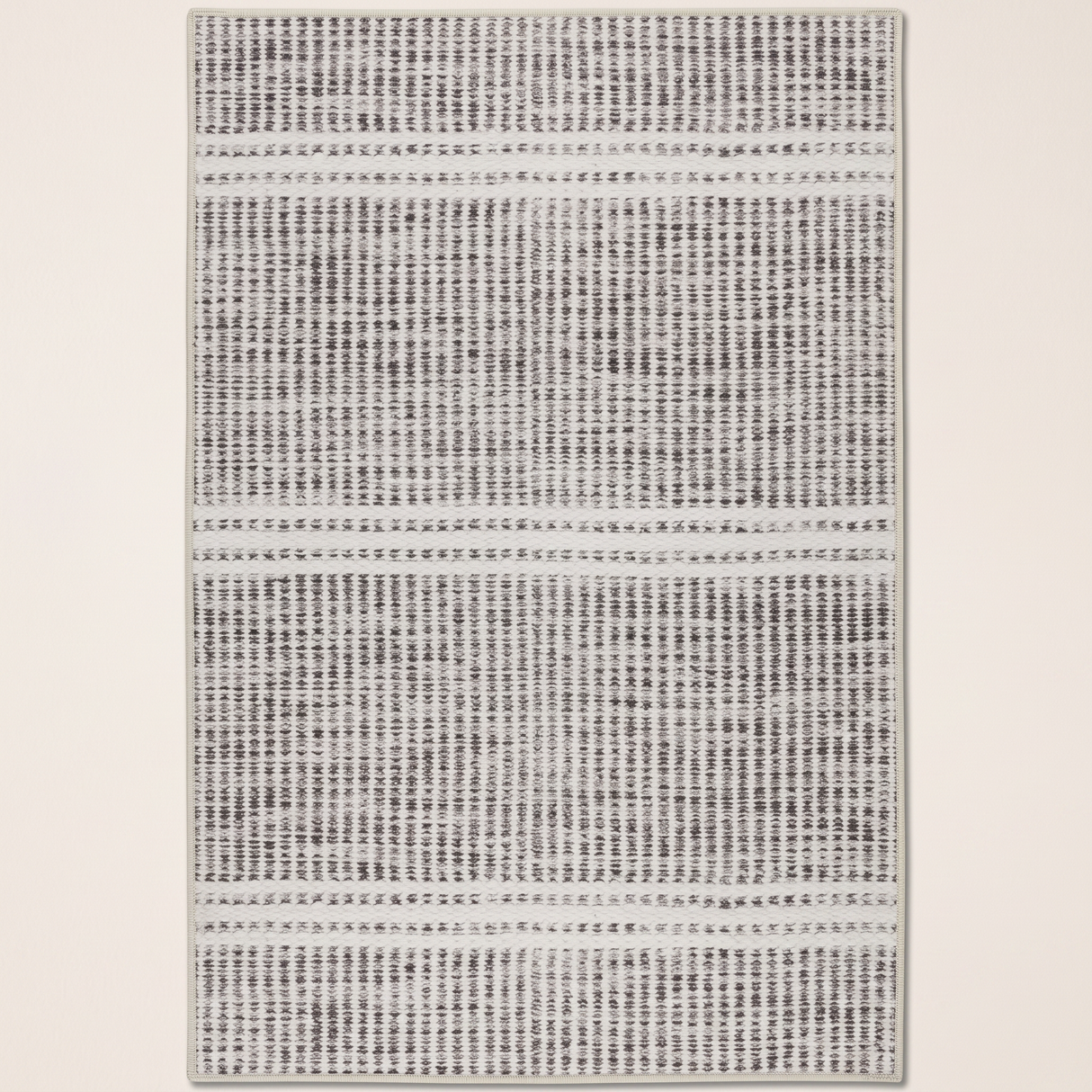 Malta grey striped washable area rug — full view on off-white backdrop