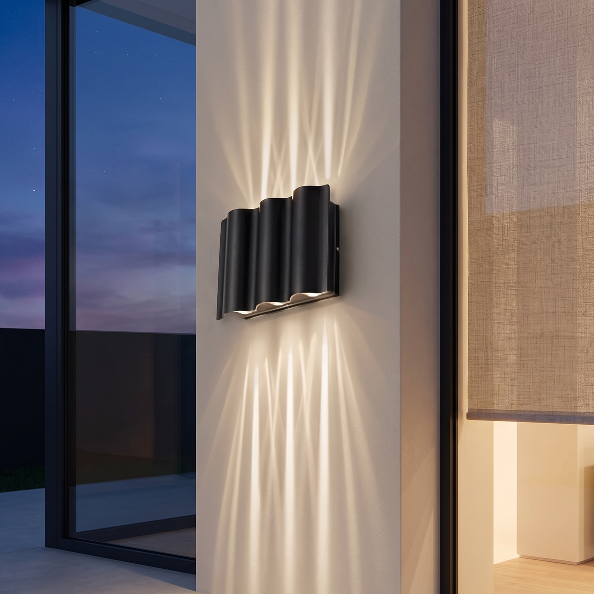 6-light wave wall sconce projecting crossing light beams up and down a limewashed exterior pillar at dusk