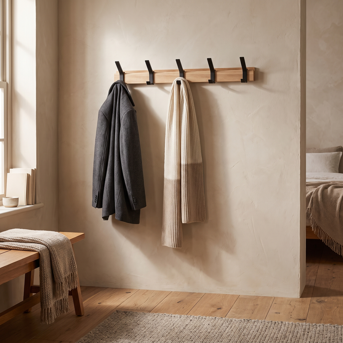 Nordby Adjustable Coat Rack — in a bedroom corner with jacket and scarf