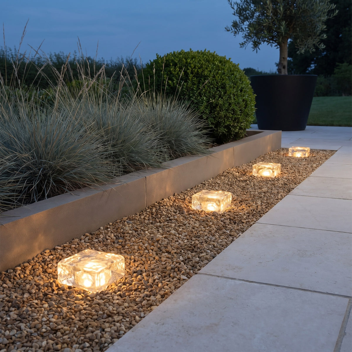 Glacier Solar Paver Light — garden path at dusk