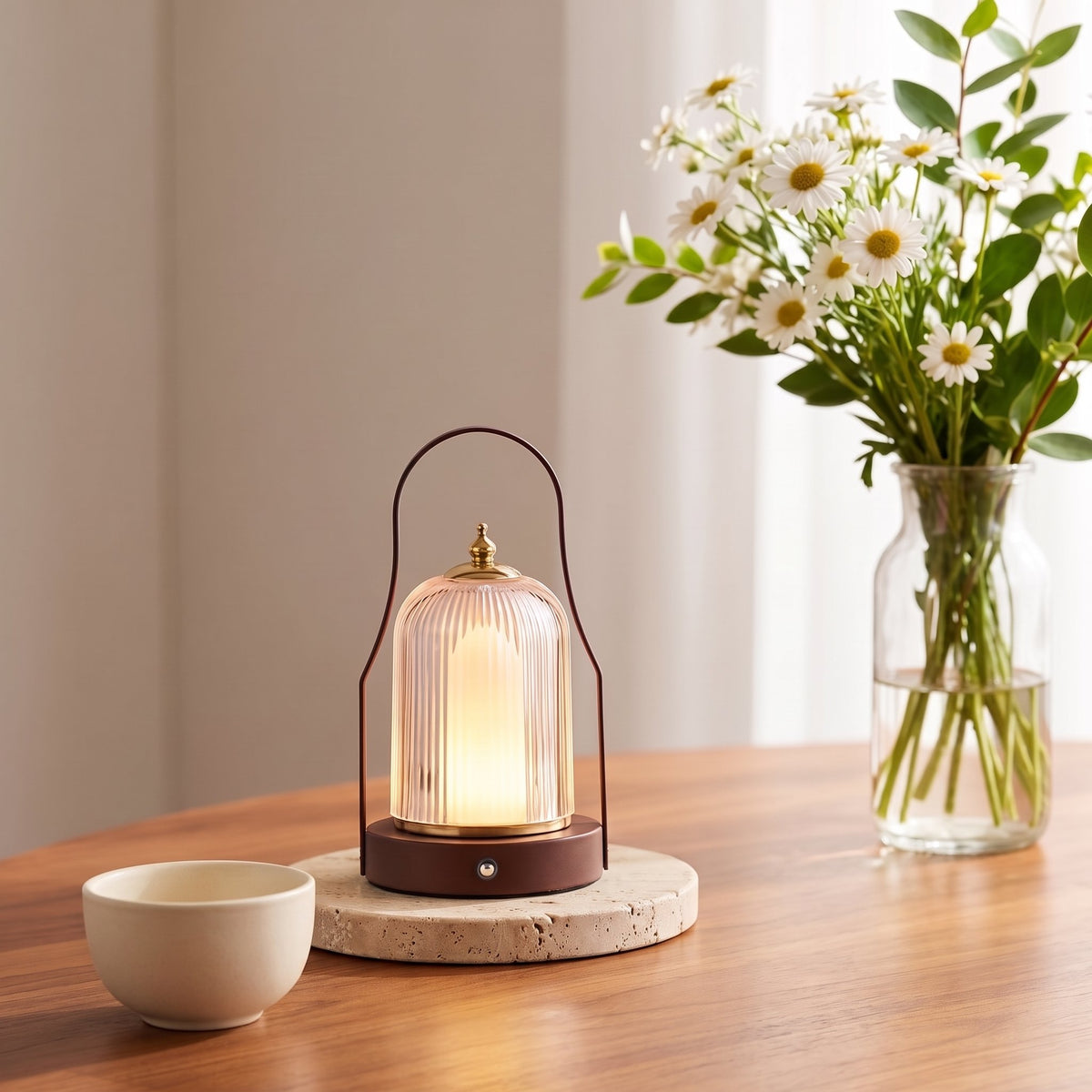 Ember Brass Lantern Lamp — Birdcage, lifestyle on wood table with daisies