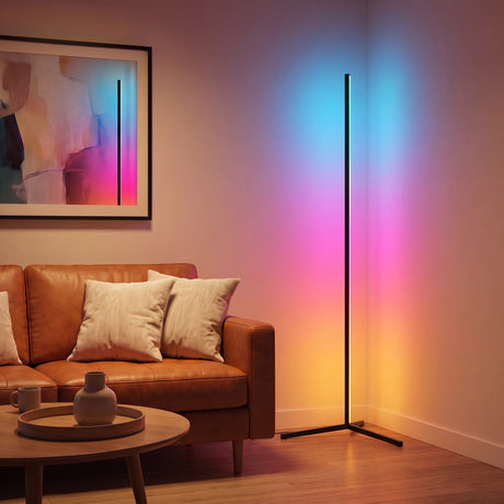 Pulse RGB Floor Lamp — multicolor glow in living room with leather sofa