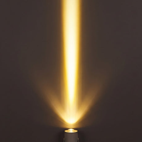 Aperture Beam Spotlight golden beam effect on a dark wall