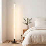 Stelo Slim Floor Lamp — bright bedroom corner