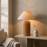 Kona Rattan Table Lamp - evening glow on a console table