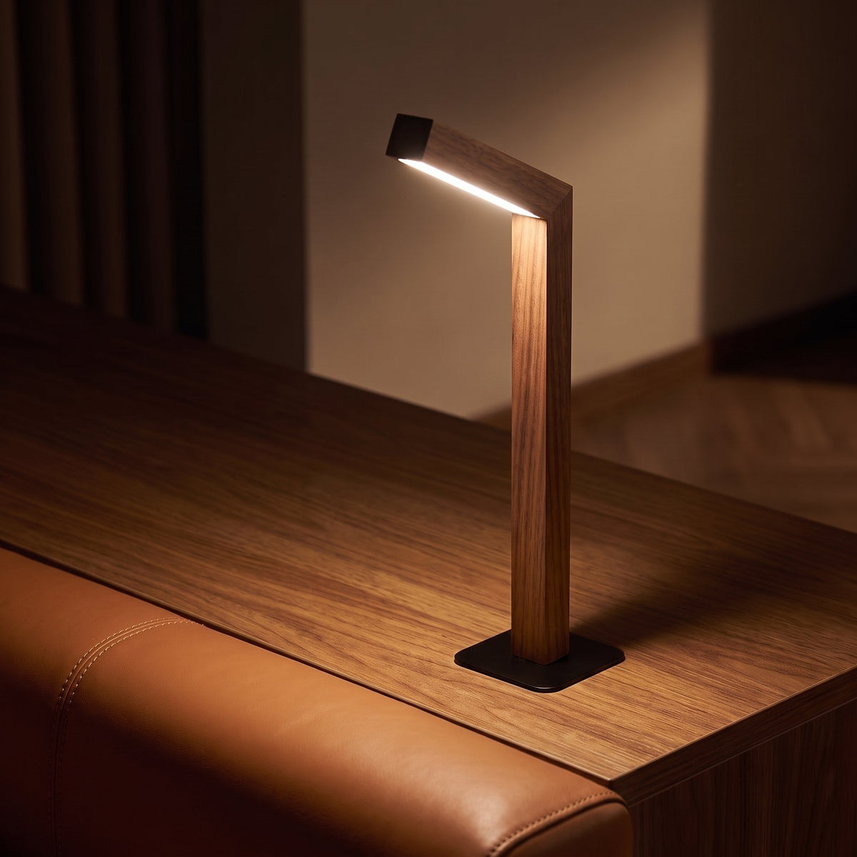 Linea Wood Strip Lamp — Walnut on side table, evening