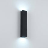 Slab Outdoor Wall Light — slim black rectangular up-and-down wall sconce glowing Cool White