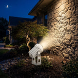Aperture Beam Spotlight washing a stone wall with warm light in a night garden