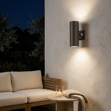 Bastion Cylinder Wall Light — patio wall at night