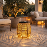 Woven Solar Lantern — patio lifestyle with signature shadow pattern
