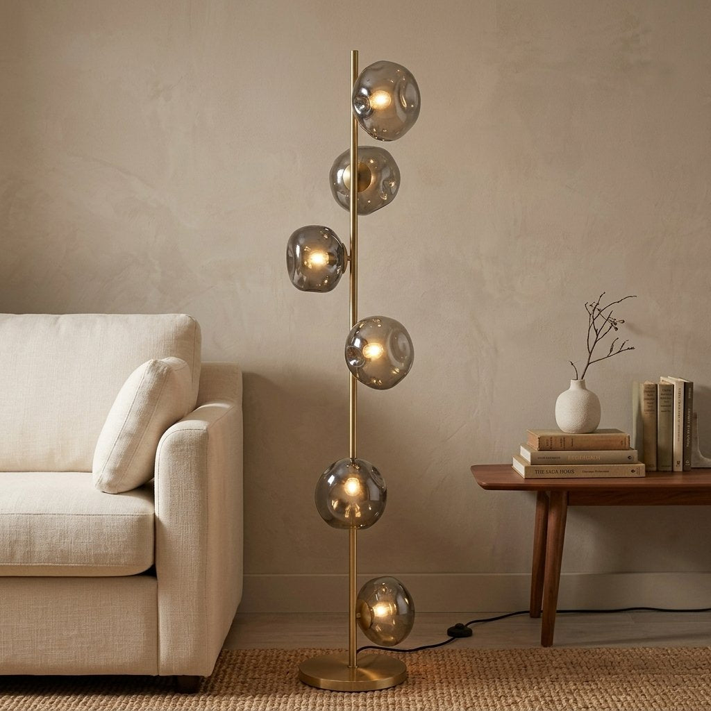 Auralis Glass Floor Lamp — Gold frame, Smoky Gray glass in living room setting