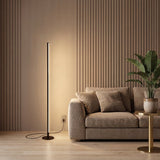 Stelo Slim Floor Lamp — warm living room with wood-slat wall