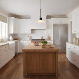 Puck Glass Pendant — clear glass in a bright kitchen