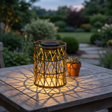 Woven Solar Lantern — garden lifestyle with criss-cross shadow pattern