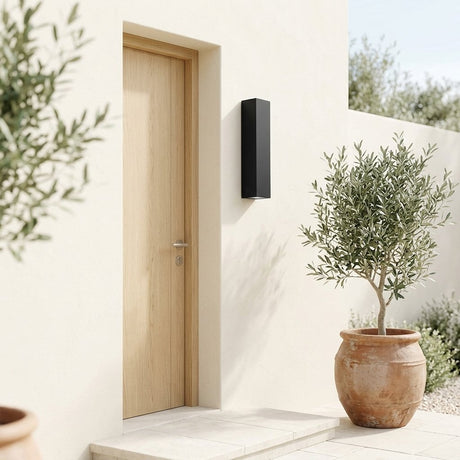 Slab Outdoor Wall Light mounted beside an oak front door on a sunlit cream wall