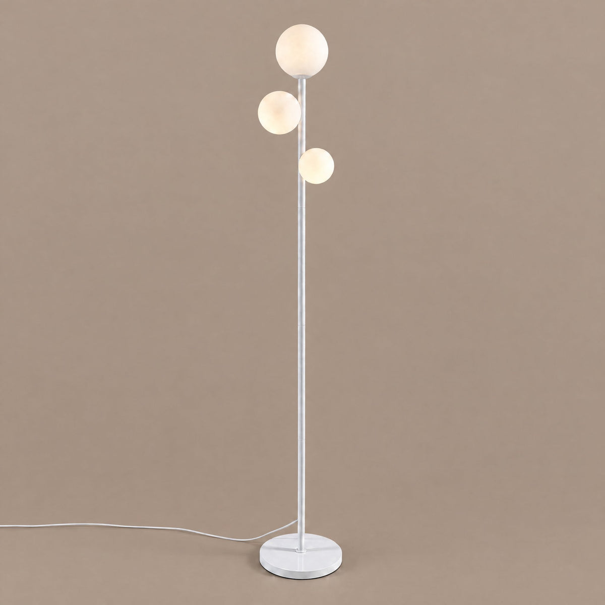 Trio Globe Floor Lamp — White, angled studio view