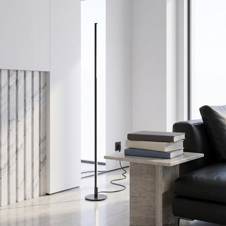 Stelo Slim Floor Lamp — minimalist living room with marble-slat wall