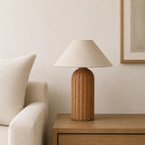 Kona Rattan Table Lamp - beside a sofa