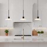 Puck Glass Pendant — three pendants above a marble backsplash
