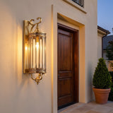 Corbel Wall Lantern — lit beside a front door at dusk