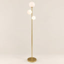 Trio Globe Floor Lamp — Gold hero, off-white background
