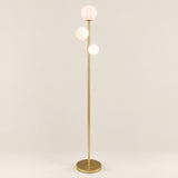 Trio Globe Floor Lamp — Gold hero, off-white background