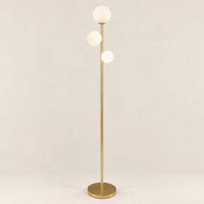 Trio Globe Floor Lamp — Gold hero, off-white background