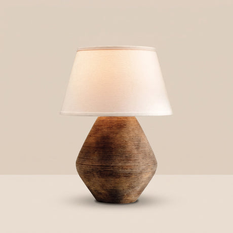 Reggio Ceramic Table Lamp — lit, sand backdrop