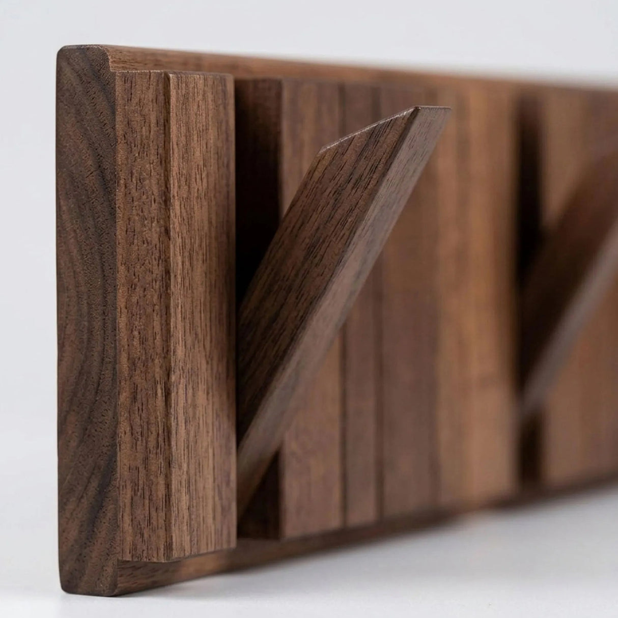 Modern Nordic Walnut Coat Rack — fold-down hook close-up