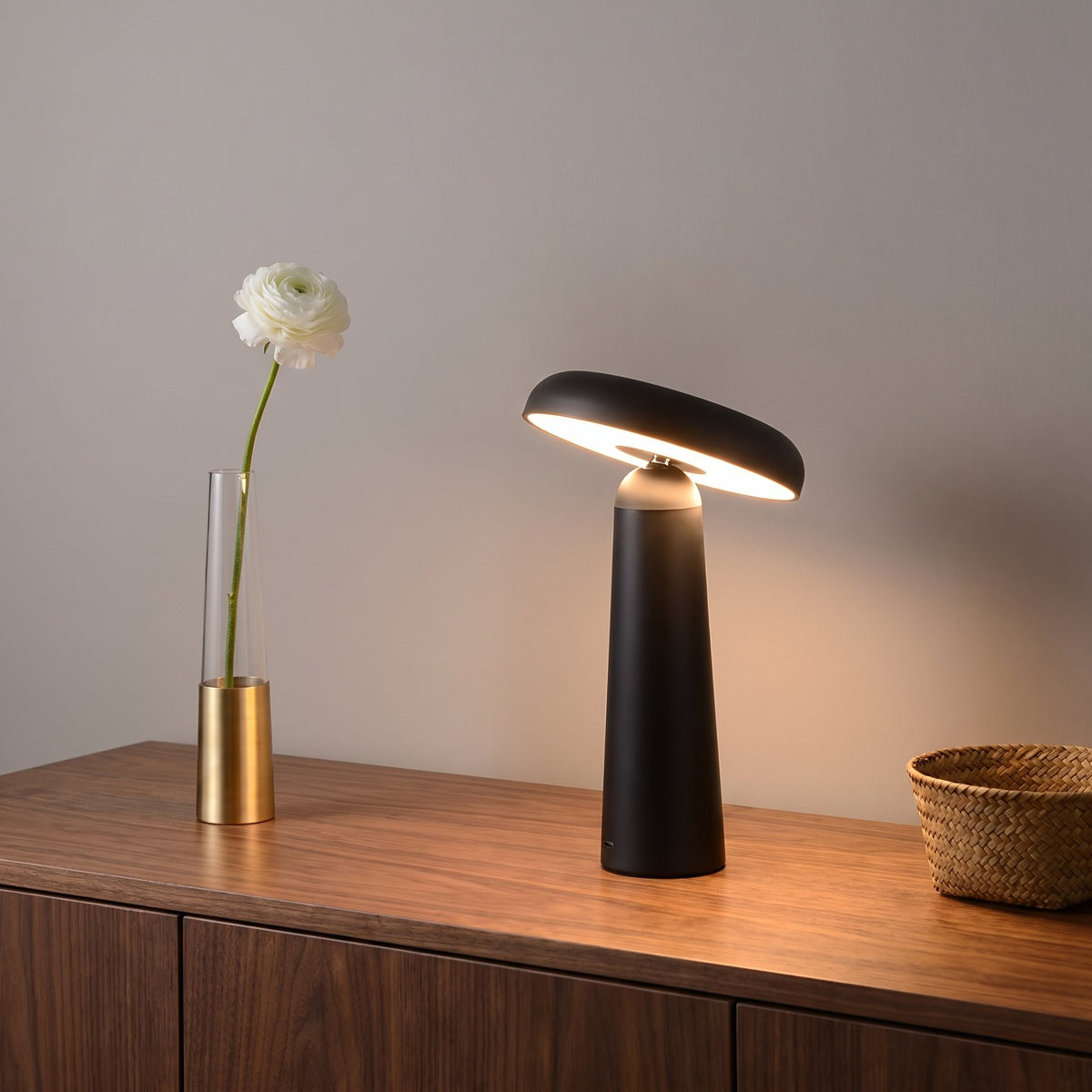 Porcini Table Lamp — Black, lit, on walnut sideboard