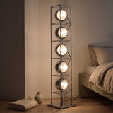 Orbit Bauhaus Floor Lamp — Silver lit in bedroom at dusk