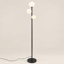 Trio Globe Floor Lamp — Black hero, off-white background