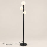 Trio Globe Floor Lamp — Black hero, off-white background