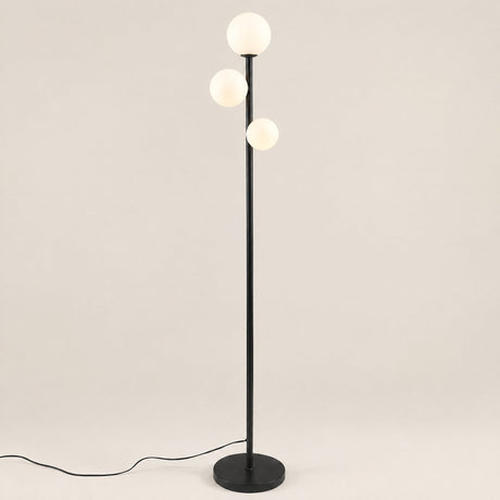 Trio Globe Floor Lamp — Black hero, off-white background