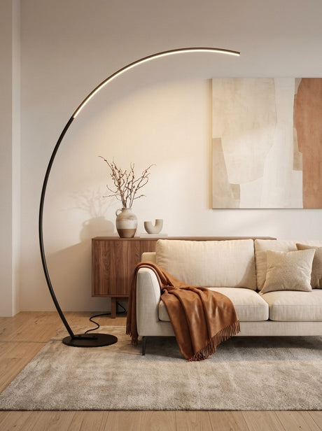 Crescent Arc Floor Lamp — Black, in a living room beside a sideboard
