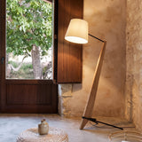 Timber Tilt Floor Lamp — rustic sunroom with window