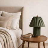 Plisse Fabric Table Lamp — Green, on a bedside table