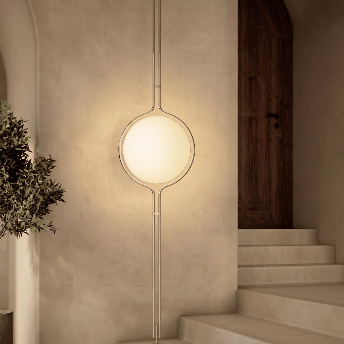 Chrome Globe Column Lamp — plaster hallway beside a staircase