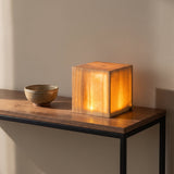 Grove Cube Lamp — cube on walnut console