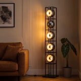 Orbit Bauhaus Floor Lamp — Black in living room at dusk