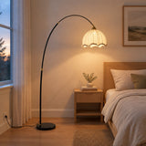 Arden Arc Floor Lamp — bedroom in early evening, lamp on
