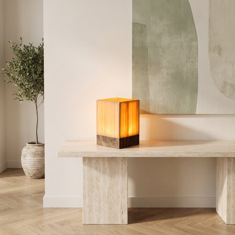 Grove Cube Lamp — tall square lamp on travertine console, living room