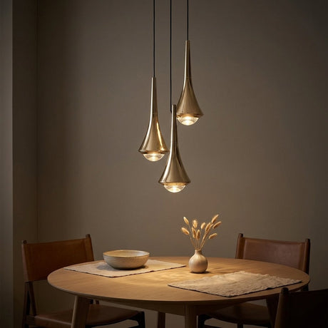 Teardrop Mini Pendant — Gold pendants over a round dining table at dusk