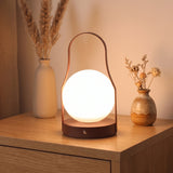 Ember Brass Lantern Lamp — Moon, lifestyle on oak cabinet