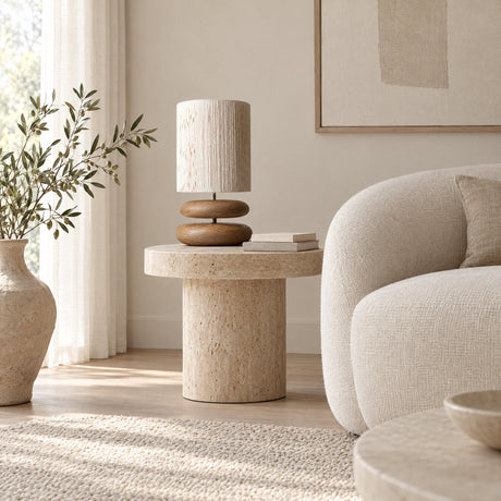 Dune Stacked Table Lamp — on a travertine side table in a living room
