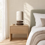 Dune Stacked Table Lamp — Walnut on an oak bedside table